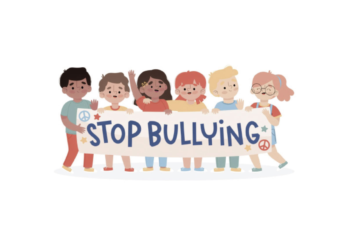 Imagen de varios niños sosteniendo un cartel que pide que pare el bullying